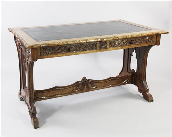 A late 19th / early 20th century Gothic carved oak library table, W.4ft 3.5in.